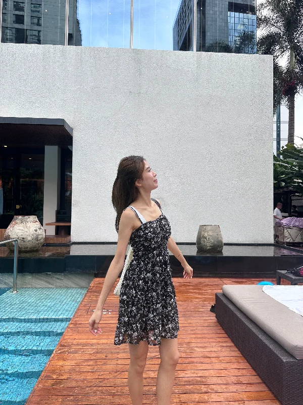 Mini dresses with side slits for a sexy appeal Black Floral Mini Dress