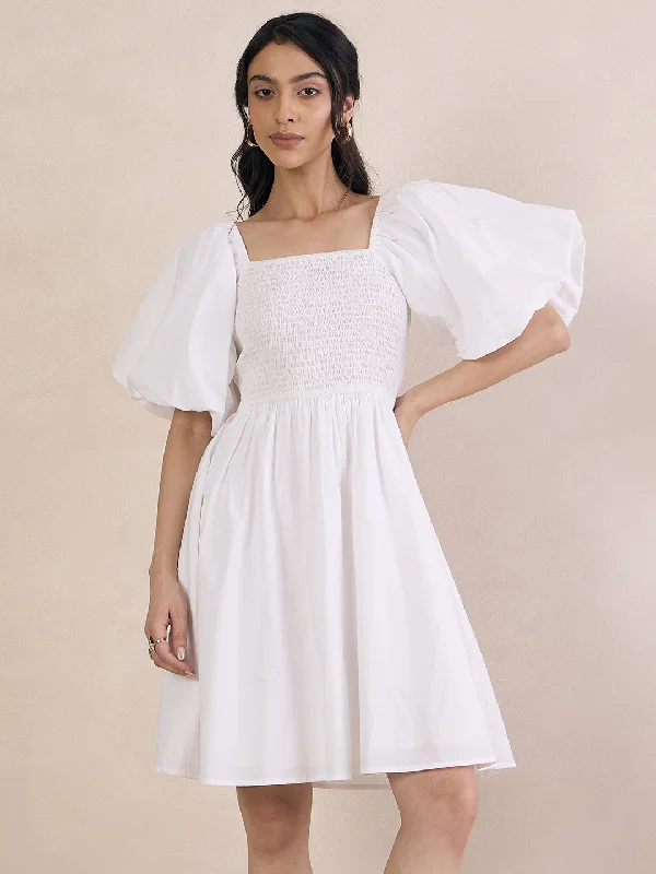 Mini dresses with asymmetric hems for a fashion - forward look White Poplin Smocked Mini Dress Mini dresses with asymmetric hems for a fashion - forward look White Poplin Smocked Mini Dress