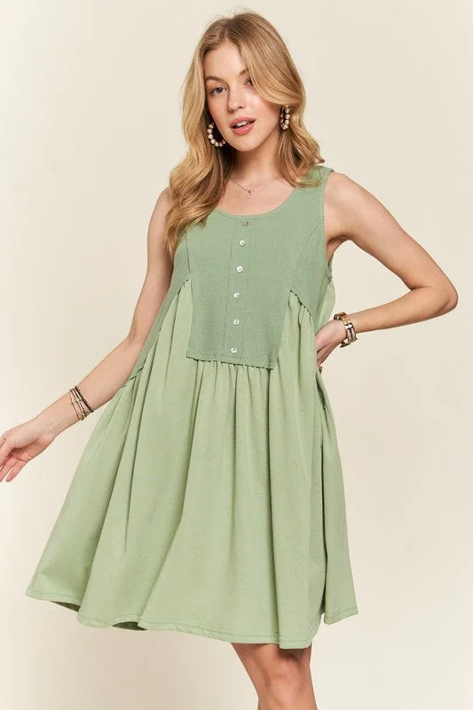 Mini dresses with tassel accents for a fun touch ADORA Decorative Button Sleeveless Babydoll Dress Mini dresses with tassel accents for a fun touch ADORA Decorative Button Sleeveless Babydoll Dress