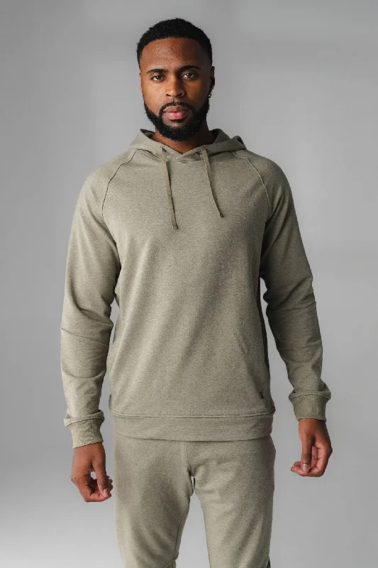 Women's hoodie with a kangaroo pocket and a pom - pom drawstring for added charmVitality Uni Studio Hoodie - Matcha Marl Women's hoodie with a kangaroo pocket and a pom - pom drawstring for added charmVitality Uni Studio Hoodie - Matcha Marl