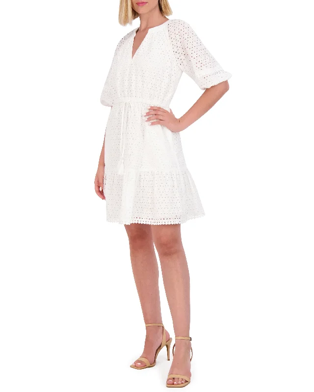 Mini Women Dress with a Short Hem for a Young and Trendy Style Mini Women Dress with a Short Hem for a Young and Trendy Style Cotton Eyelet Tasseled Drawstring Dress