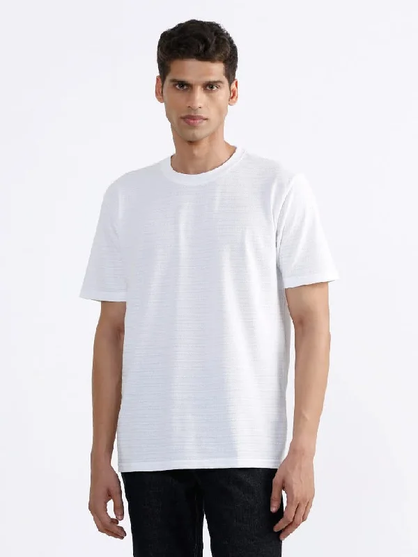 Cuffed Women Shorts for a Laid - Back and Trendy LookWES Casuals Solid White Cotton Blend Relaxed-Fit T-Shirt